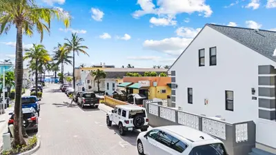 a city street with cars parked on the street at Modern Loft wBed Steps from Beach Boardwalk in Hollywood