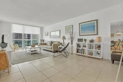 a living room with a couch and a chair at THE TIDES 2bedrooms apt 14th floor WE ARE ON THE BEACH! in Hollywood