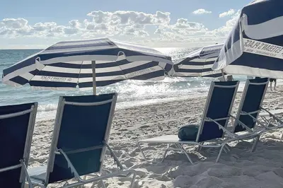 a group of chairs and umbrellas on a beach at THE TIDES 1bedroom apt 15th floor WE ARE ON THE BEACH! in Hollywood