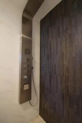 a shower stall in a bathroom with a glass door at Yacht Club at Aventura 1 Bd 1 Bth Brand New in Aventura