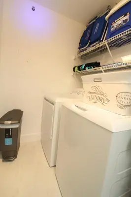 a kitchen with a white refrigerator and a trash can at Yacht Club at Aventura 1 Bd 1 Bth Brand New in Aventura