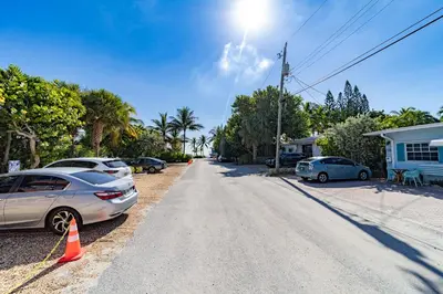 a street with cars parked on the side of the road at The Desoto - Oceanview Inn in Hollywood