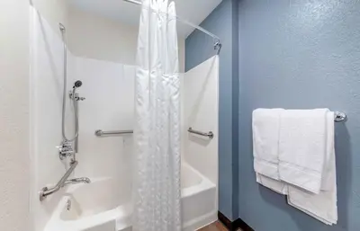 a bathroom with a shower with a shower curtain at Extended Stay America Premier Suites - Miami - Airport - Doral - 87th Avenue South in Miami