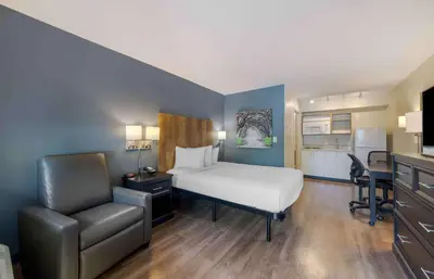 a bedroom with a bed and a desk and a chair at Extended Stay America Suites - Miami - Airport - Doral in Miami