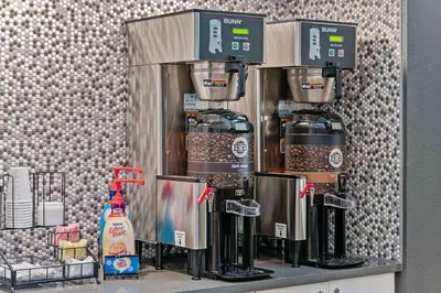 a coffee machine sitting on top of a counter at Extended Stay America Suites - Miami - Airport - Doral in Miami