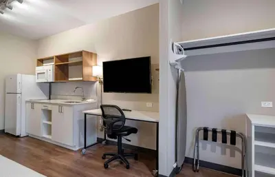 a kitchen with a desk and a chair in a room at Extended Stay America Premier Suites - Fort Lauderdale - Convention Center - Cruise Port in Fort Lauderdale