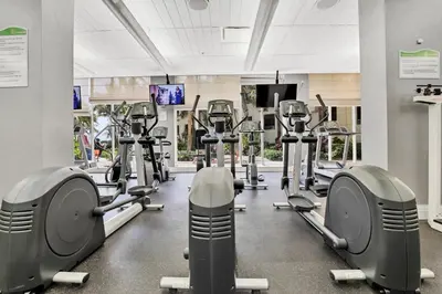 a gym with rows of treadmills and machines at THE TIDES 1 bedroom apt 10 floor WE ARE ON THE BEACH! in Hollywood