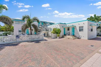 a house with a brick driveway in front of it at Hollywood Beachside Boutique Suite in Hollywood