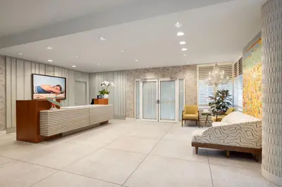 a living room with a bed and a couch at Hotel Continental Miami Beach, Tapestry Collection by Hilton in Miami Beach