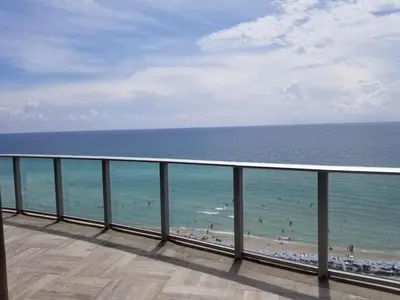 a view of the ocean from a balcony of a beach at Rent in LYFE Resort in Hollywood