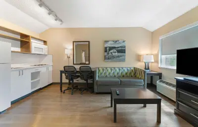 a living room with a couch and a table at Extended Stay America Premier Suites - Miami - Airport - Miami Springs in Miami