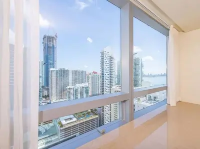 a large window with a view of the city at Signature Suite at Four Seasons Residences - Limited Time Offer in Miami