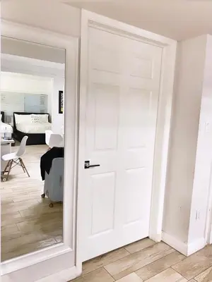 a white door in a room with a bedroom at 2 Bedroom Ocean Drive Newly Renovated in Miami Beach