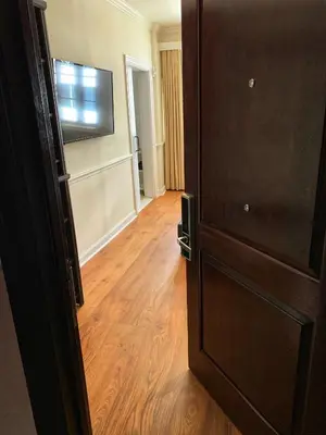 an open door to a room with a wooden floor at Hotel St. Michel in Miami