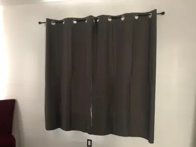 a black shower curtain hanging on a wall at Close to Everything Miami in Miami