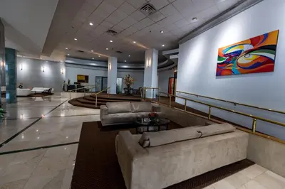 a lobby with a couch and a painting on the wall at Casablanca on the beach, Oceanfront Studio Miami Beach in Miami Beach