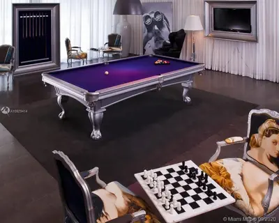a living room with a purple pool table and a chessboard at Luxury Waterfront Condo In The Urban Oasis At Icon-Brickell Free Spa in Miami
