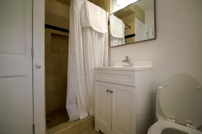 a bathroom with a toilet and a sink and a shower at Shore View Hotel in Hollywood