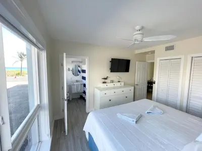 a bedroom with a white bed and a window at Shore View Hotel in Hollywood