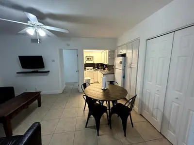 a kitchen and dining room with a table and chairs at Shore View Hotel in Hollywood