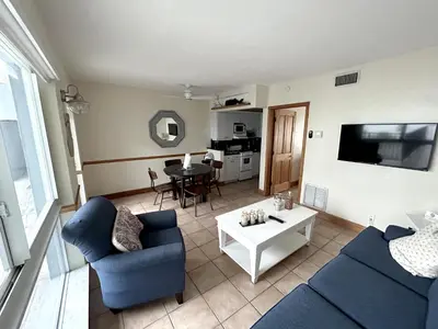 a living room with a blue couch and a table at Shore View Hotel in Hollywood