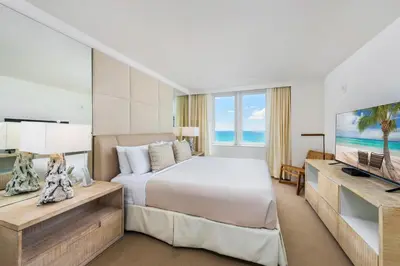 a bedroom with a bed and a flat screen tv at Oceanview Private Condo at 1 Hotel & Homes -1544 in Miami Beach