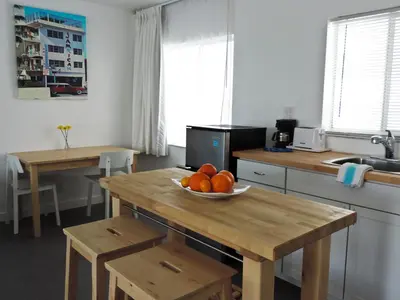 a kitchen with a bowl of oranges on a table at Snooze in Fort Lauderdale