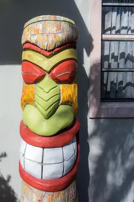 a statue of a clown sitting on top of a pole at Richard's Motel in Hollywood