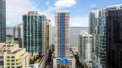 an aerial view of a city with tall buildings at Miami Brickell 4 Bedrooms High Ceiling loft on the pool in Miami
