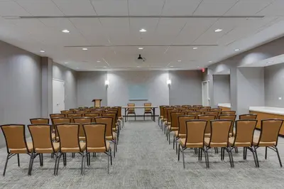 an empty room with chairs and a podium in it at SpringHill Suites by Marriott Fort Lauderdale Miramar in Miramar
