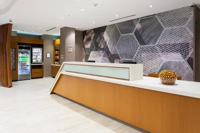 a lobby of a hospital with a reception counter at SpringHill Suites by Marriott Fort Lauderdale Miramar in Miramar