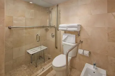 a bathroom with a toilet and a shower at DoubleTree by Hilton Grand Hotel Biscayne Bay in Miami