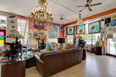 a living room filled with furniture and colorful walls at James Hotel in Miami Beach