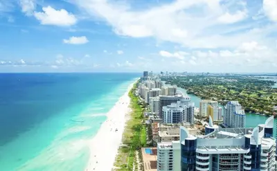 an aerial view of the beach and the ocean at 1 Hotel & Homes Miami Beach Oceanfront Residence Suites By Joe Semary in Miami Beach