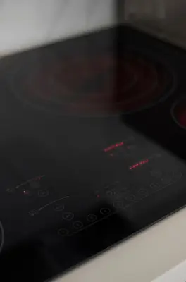 a control panel of a microwave with red lights at Sobe Lux in Miami Beach
