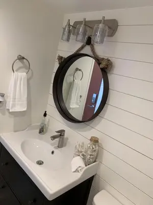 a bathroom with a sink and a mirror at Direct Ocean View Condo at Tides of Hollywood - 7N in Hollywood