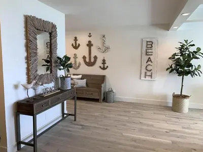 a room with a mirror and a table with a plant at Direct Ocean View Condo at Tides of Hollywood - 7N in Hollywood