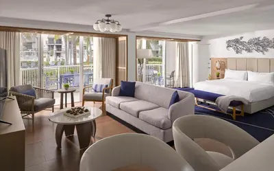 a hotel room with a bed and a couch at Hilton Fort Lauderdale Marina in Fort Lauderdale