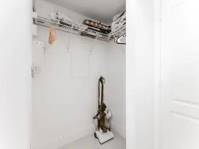 a kitchen with white walls and a sink at Beautiful Apartment in the Heart of Brickell in Miami