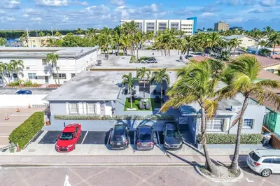 an aerial view of cars parked in a parking lot at Modern apt wqueen bed beach steps in Hollywood