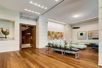 a living room with a couch and a table at Ocean View Balcony steps from Restaurants, Peacock Park & Marina in Miami