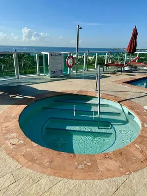 a small pool of water in the middle of a patio at City View Balcony steps from Restaurants, Peacock Park & Marina in Miami