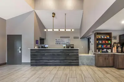 a large lobby with a counter and a pharmacy at Sleep Inn Miami Airport in Miami