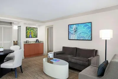 a living room with a couch and a table at DoubleTree by Hilton Hotel Miami Airport & Convention Center in Miami