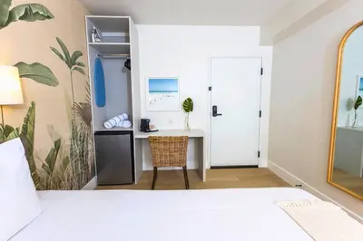 a bedroom with a bed and a desk at Casa Ocean in Miami Beach