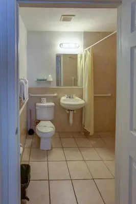 a bathroom with a toilet and a sink at Richard's Hotel in Hollywood