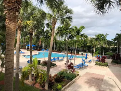 an image of a pool at a resort with palm trees at Ocean Reserve 14th floor - Wonderful Ocean View - STR00454 in Miami Beach