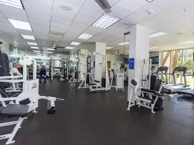 a gym with lots of equipment and people in it at Ocean Reserve 14th floor - Wonderful Ocean View - STR00454 in Miami Beach