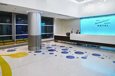 a lobby of a hotel with a reception desk at Miami International Airport Hotel in Miami