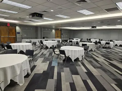 a conference room with white tables and chairs at Miami International Airport Hotel in Miami